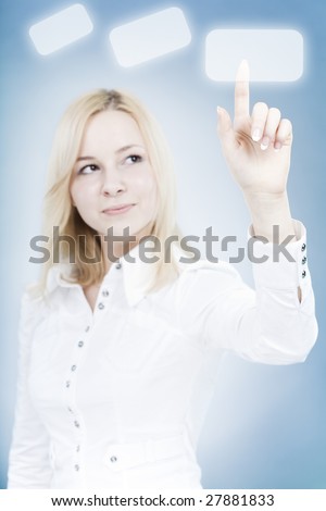 Young businesswoman touching a virtual button. Conceptual business image. Focus on hand and finger