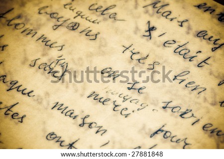 An old hand written paper with a grunge appeal from water damage. Vintage colors image