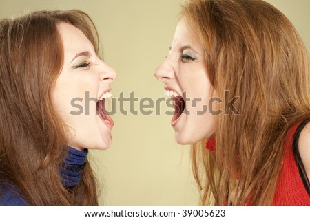 Two teenage girls screaming to each other