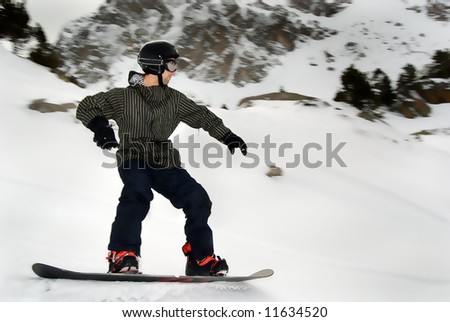 young man snowboarding in the moutain off track