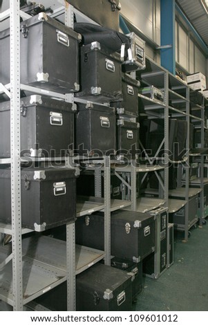 A metal rack of boxes in a warehouse