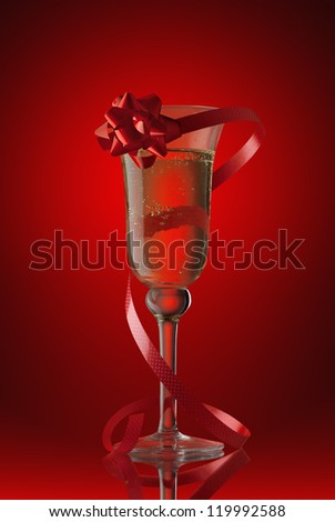 champagne glass with a red tape and a bow on  red background