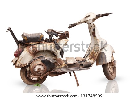 the old, rusty motorcycle is isolated on white background