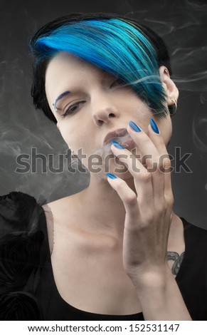 the beautiful sexy girl with blue hair. smoking