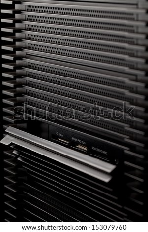 Black computer box. PC devices on dark background.