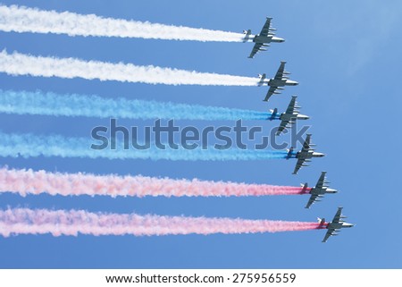 MOSCOW, RUSSIA - MAY 7, 2015: A group of aircraft in-flight smoke color Russian flag. Rehearsal of parade devoted to May 9, 70-th Victory Day in World War II. May 7, 2015 in Moscow.