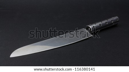 Stainless steel knife on a black background