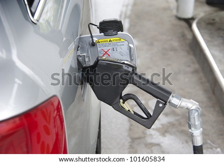 Filling up gas at fuel pump