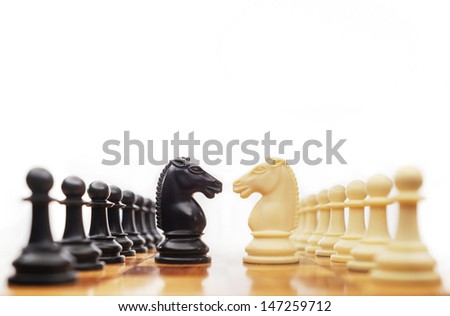 Chess horses facing each other for a standoff