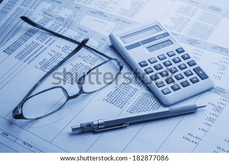 accounting work space with calculator, profit and loss statements