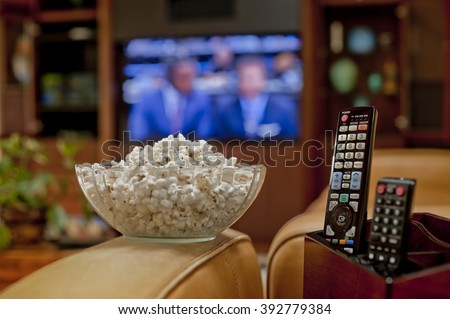 Ready to watch the game on TV with bowl of pop corn and remote
