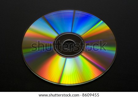 CD or DVD shot at 45 degree on black background