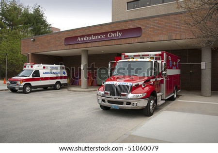 Ambulance pulling up to emergency entrance of a hospital