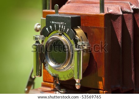 Close up of antique camera lens in mahogany and brass