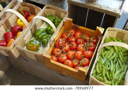 Assorted vegetables in baskets at a farmers market