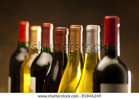 Wine bottles in a row with limited depth of field