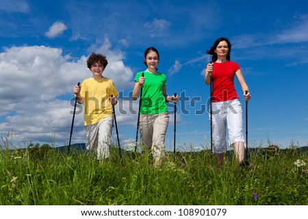 Nordic walking - active family exercising outdoor
