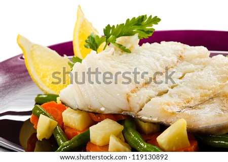 Fish dish - fish fillet in sauce and vegetables