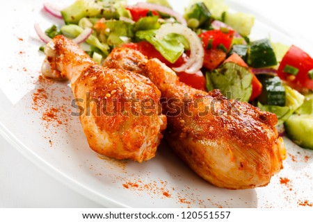 Roasted chicken drumsticks and vegetables