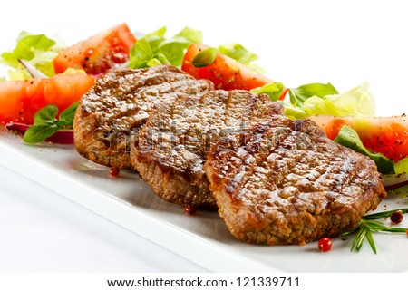 Grilled steaks and vegetables