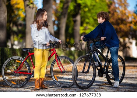Urban biking - teens and bikes in city