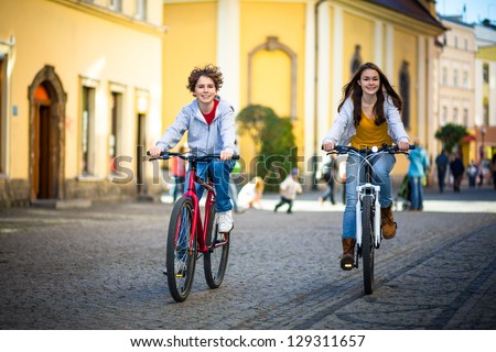 Urban biking - teens and bikes in city