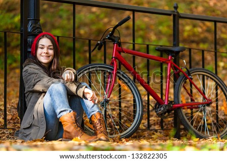 Urban biking - teenage girl and bike in city