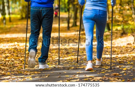 Nordic walking - active people working out outdoor