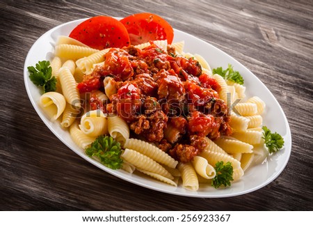 Pasta with meat, tomato sauce and vegetables
