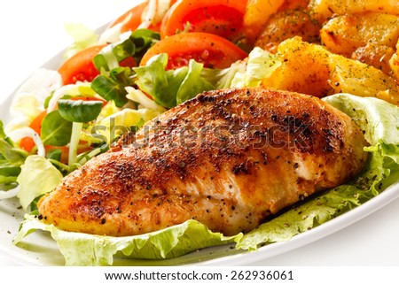 Fried chicken fillet, boiled potatoes and vegetable salad