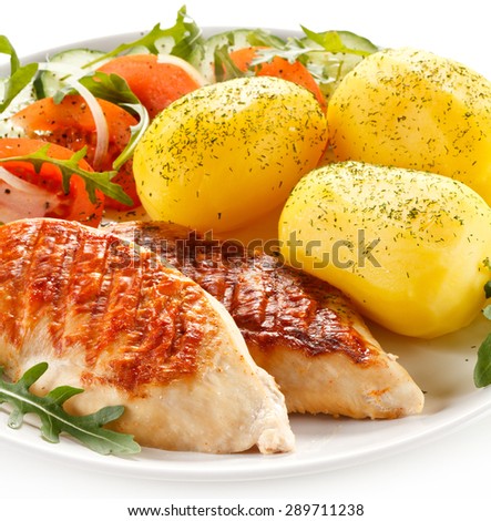 Grilled chicken fillets, boiled potatoes and vegetable salad