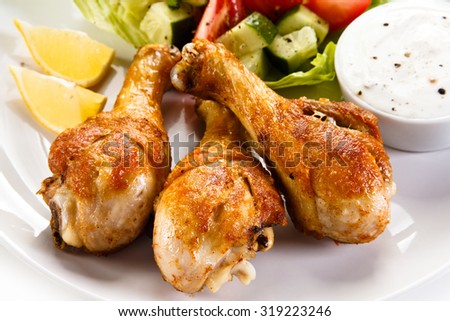 Roasted chicken drumsticks and vegetables