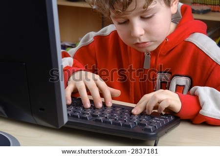 Young boy is learning computer literacy