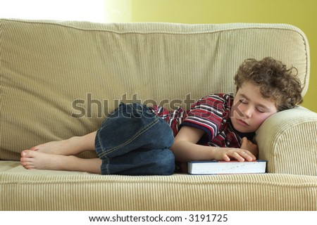 Young boy fell asleep during reading