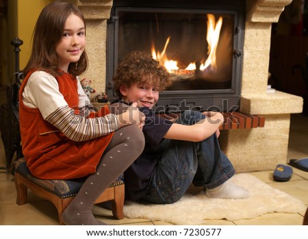 Kids sitting near fireplace