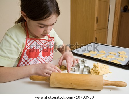 Young girl baking cakes