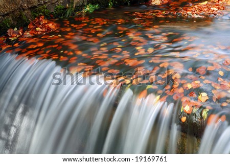 Water flow in autumn scenery - long exposure