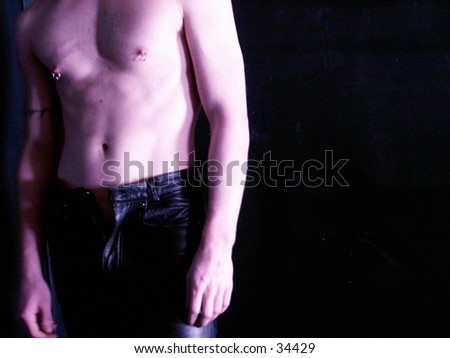 Male chest and leather pants.