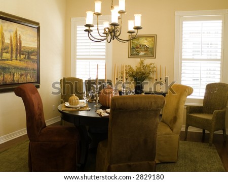 Very attractive dining room with fall table setting.