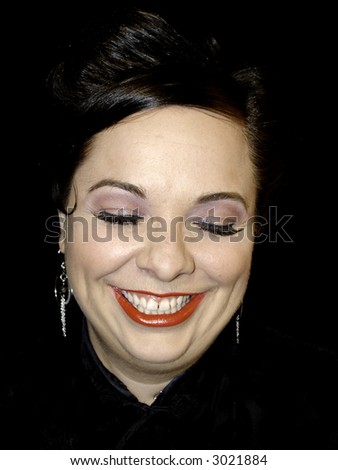 Woman on black laughing