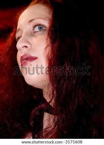 Red haired woman with unique look.