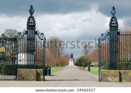 view to statue of andrew carnegie through park gates