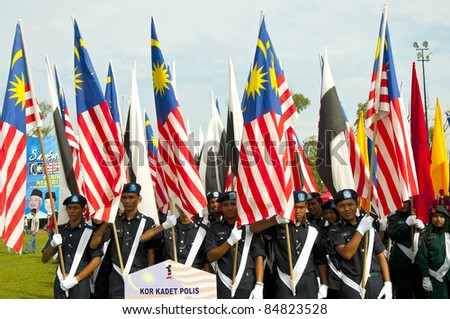KUANTAN- SEPT 16: Police cadet corps in the National Day and Malaysia Day parade, celebrating the 54th anniversary of independence on September 16, 2011 in Kuantan, Pahang, Malaysia.