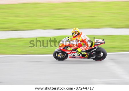 SEPANG, MALAYSIA - OCTOBER 21: MotoGP rider Valentino Rossi tests his bike during the free practice session at the Shell Advance Malaysian Motorcycle GP 2011 on October 21, 2011 at Sepang, Malaysia.