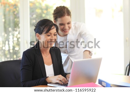 Two women working together in the office