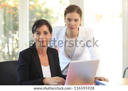Two women working together in the office