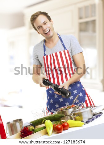 Young man cooking in the kitchen