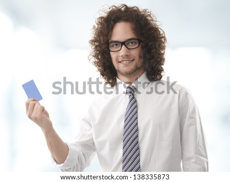 Business man handing a blank business (credit) card