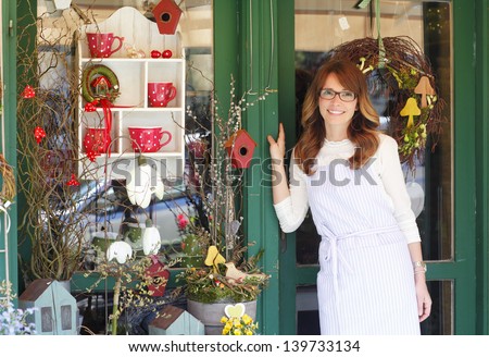 Smiling Mature Woman Florist Small Business Flower Shop Owner. Shallow Focus.