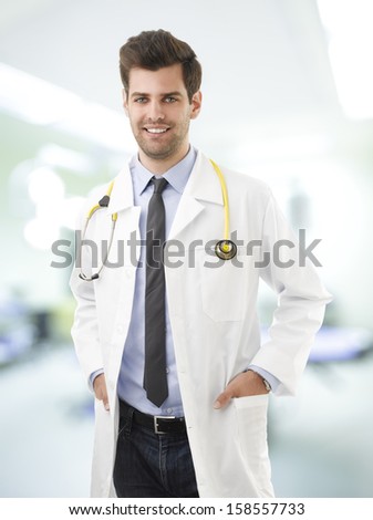 Portrait of happy young  medical doctor standing  in Hospital